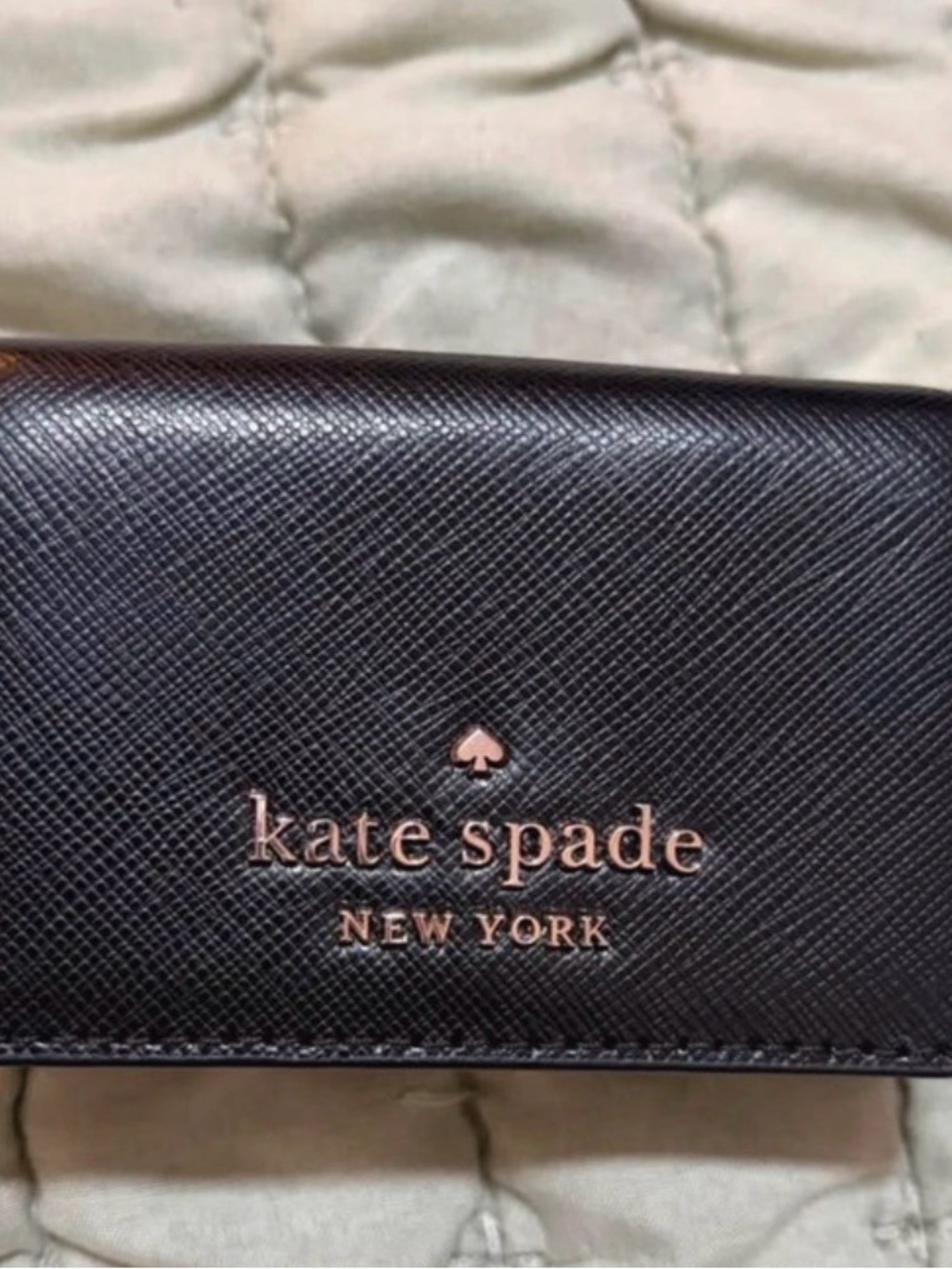 kate spade black wallet with rose gold logo